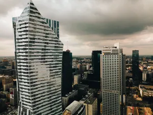 Aerial view of the modern Warsaw skyline with striking skyscrapers and dramatic clouds. jigsaw puzzle