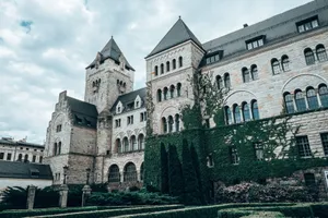 Explore the iconic Imperial Castle in Poznań, showcasing medieval style and lush greenery. jigsaw puzzle