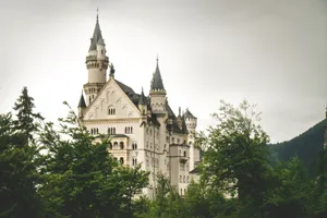 Gothic Neuschwanstein Castle in Schwangau, Bavaria, surrounded by lush greenery and historic charm. jigsaw puzzle