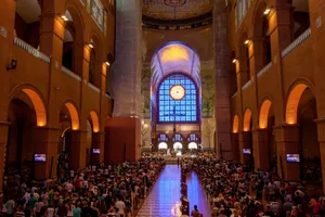 A vibrant scene inside Brazil's renowned Basilica of Aparecida during mass. jigsaw puzzle