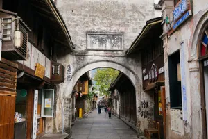 Explore the charm of an ancient Chinese street in a vibrant cityscape. jigsaw puzzle
