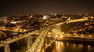 Dramatic night photo of Porto with the iconic Luis I Bridge, beautifully illuminated. jigsaw puzzle