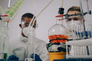 Two scientists in protective gear conducting experiments in a laboratory setting. jigsaw puzzle
