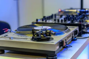 Close-up of a turntable and mixer, essential DJ equipment for music production and performance. jigsaw puzzle