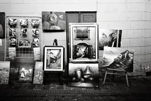Black and white photograph showcasing street art and paintings in Quito, Ecuador's historic district. jigsaw puzzle