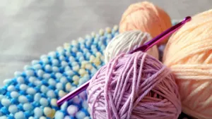 Vibrant yarn and crochet hook on textured fabric. Perfect for craft projects. jigsaw puzzle