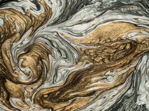 Close-up of a swirling metallic abstract pattern with gold and silver hues. jigsaw puzzle