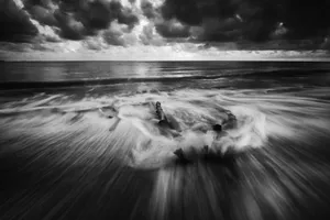 Captivating black and white long exposure of the ocean with dynamic waves and dramatic clouds. jigsaw puzzle