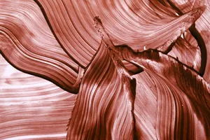 Abstract red brushstroke pattern creating a fluid and artistic wave effect. jigsaw puzzle
