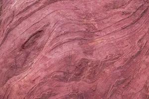 Close-up of red sandstone showing intricate natural patterns and texture. jigsaw puzzle