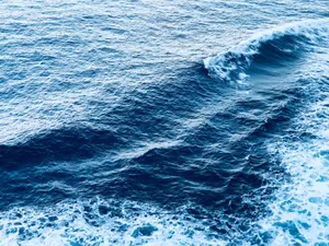 A captivating view of dynamic ocean waves with foam, showcasing the beauty of the sea. jigsaw puzzle