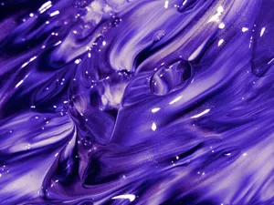 Explore the mesmerizing swirls of vivid purple paint creating a captivating abstract texture. jigsaw puzzle