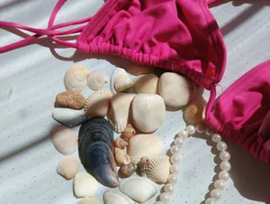 Pink bikini top with seashells and pearls creating a summer beach vibe. jigsaw puzzle