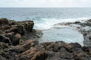 Rocky coastline with calm tide pools and ocean waves jigsaw puzzle