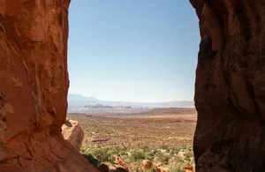 A view of a valley through a rock arch jigsaw puzzle