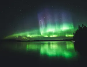 calm body of water under aurora lights jigsaw puzzle