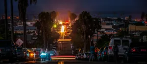 vehicles park on roadway during nighttime jigsaw puzzle