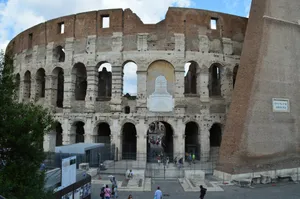 A very old building with some people walking around it jigsaw puzzle