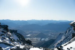 A snow covered mountain with a view of a valley jigsaw puzzle