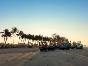A group of boats sitting on top of a sandy beach jigsaw puzzle