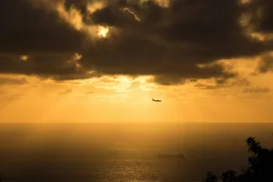 The sun is shining through the clouds over the ocean jigsaw puzzle