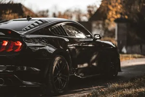 a black car on a road jigsaw puzzle