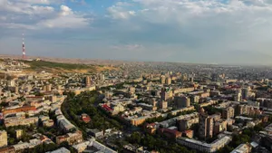 Aerial view of a sprawling city with distant hills. jigsaw puzzle