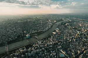 Aerial view of a sprawling city with a river. jigsaw puzzle