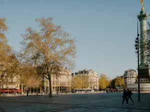 People walking in a parisian square with trees and buildings jigsaw puzzle