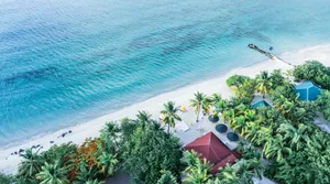Tropical island resort with white sand beach and clear water. jigsaw puzzle