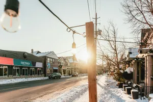 Street scene with snow and sunbeams on buildings jigsaw puzzle