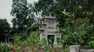 a stone structure sitting on top of a lush green hillside jigsaw puzzle