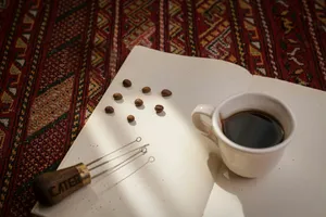 Coffee cup, beans, and tamper on patterned surface jigsaw puzzle