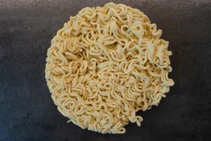 a bowl of ramen noodles on a table jigsaw puzzle