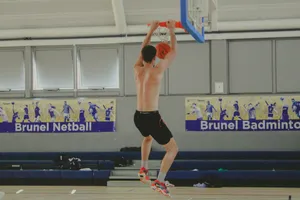a man is jumping up to dunk a basketball jigsaw puzzle