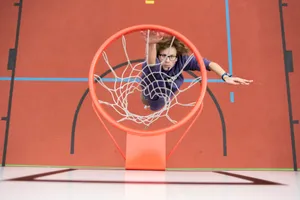 woman in black shirt sitting on basketball hoop jigsaw puzzle