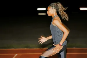 A woman standing on a tennis court holding a racquet jigsaw puzzle