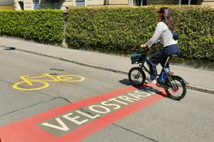 Woman riding a bicycle on a bike lane. jigsaw puzzle