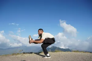 Man doing yoga pose on a mountain top. jigsaw puzzle