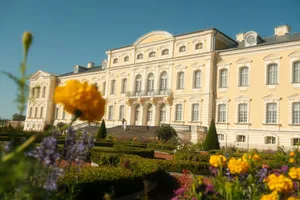A large building with a yellow flower in front of it jigsaw puzzle