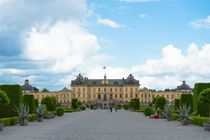 A large building with a lot of trees in front of it jigsaw puzzle
