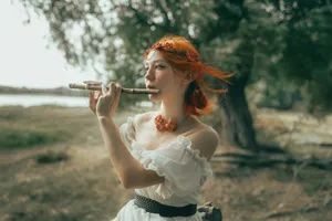 Woman with red hair plays flute outdoors jigsaw puzzle