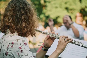 woman in white red and green floral shirt playing trumpet jigsaw puzzle