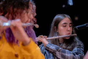 Two girls playing flutes on stage jigsaw puzzle