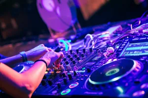 person playing dj controller with purple lights jigsaw puzzle