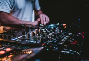 person in gray shirt playing audio mixer jigsaw puzzle