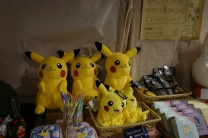 a group of stuffed pikachu sitting on top of a table jigsaw puzzle