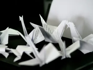 a pile of origami pieces on a table jigsaw puzzle