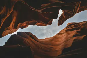 brown rock formation under white clouds during daytime jigsaw puzzle