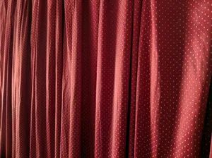 red curtain on white wall jigsaw puzzle